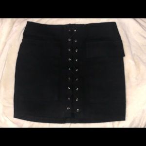 Black, lace up front skirt, with pocket detail.